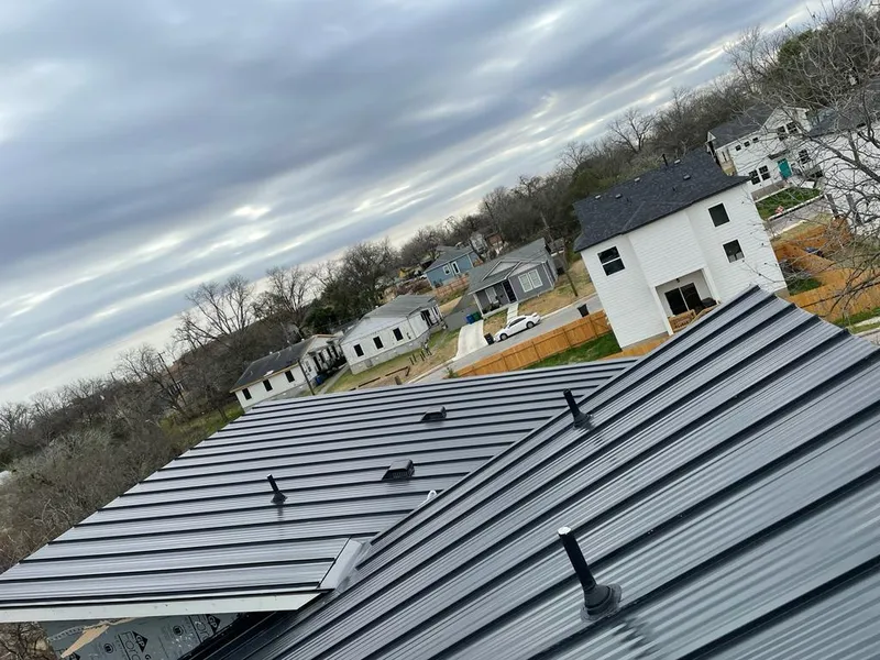 Standing seam metal roof panels with vents for Skylight Repair in Jenks